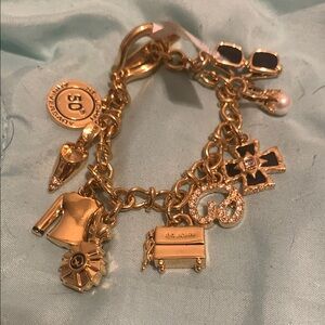 Ornate Gold Charm Bracelet with Intricate Details